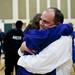 Ann Arbor Pioneer Head Coach Rex Stanczyk embraces his daughter, Kat, after defeating Father Gabriel Richard 92-89 on Tuesday. Daniel Brenner I AnnArbor.com
